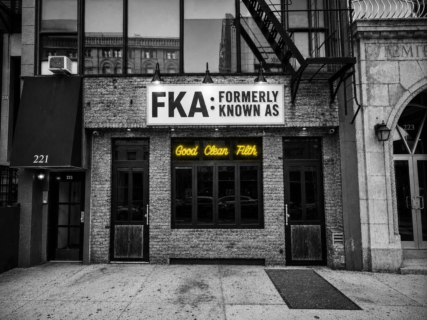 Exterior of FKA: Formerly Known As bar at 221 2nd Avenue in the East Village, New York City, with the Good Clean Filth neon sign